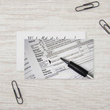 1040 income tax form with ink pen business card