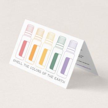 colorful essential oil bottles with use directions business card