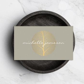 elegant gold leaf logo on tan business card