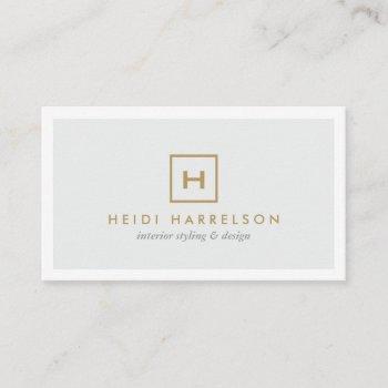 gold box logo with your initial on light gray business card
