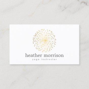 gold dandelion starburst logo on white business card