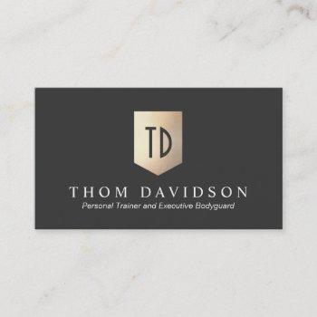 gold shield monogram logo protection and security business card