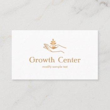 hand holding leaf plant  life coach and therapist business card