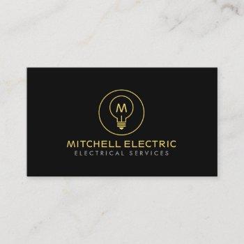light bulb monogram logo on black for electricans business card