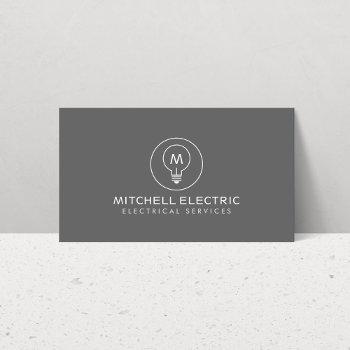 light bulb monogram logo on gray for electricans business card