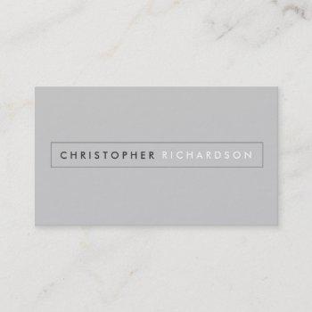 modern and minimal boxed name logo on gray business card