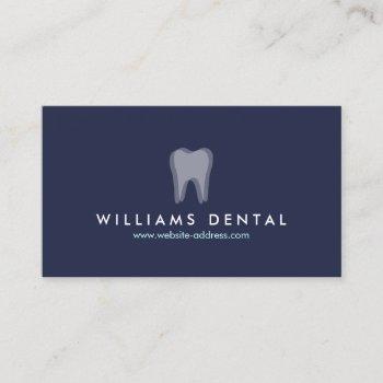 modern dentist tooth logo on navy blue business card
