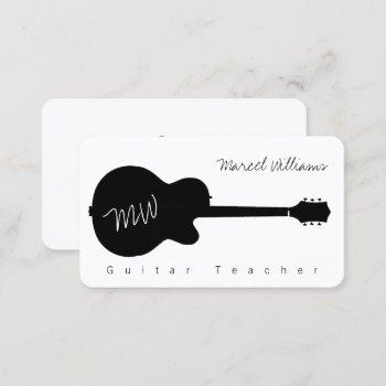 music white business card with a blk. guitar