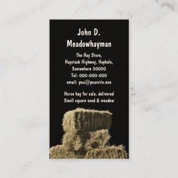 square hay bales in a stack black background business card