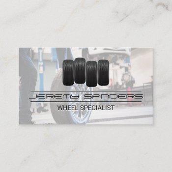 tire and wheel service | man working on tires business card